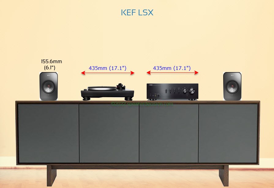 KEF LSX placed next to an amplifier and turntable