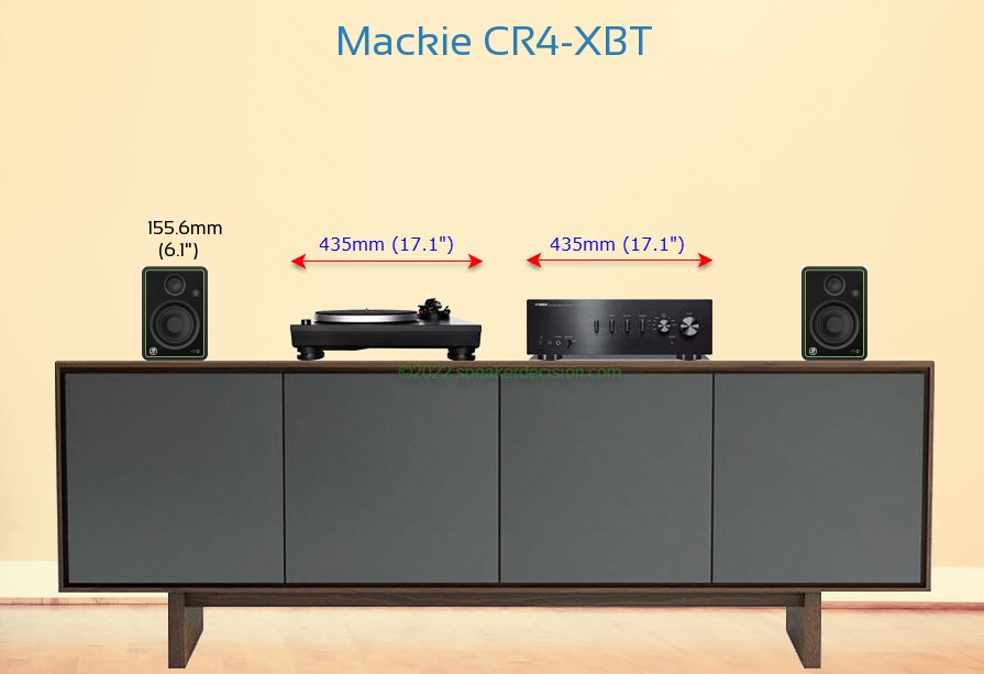 Mackie CR4-XBT placed next to an amplifier and turntable