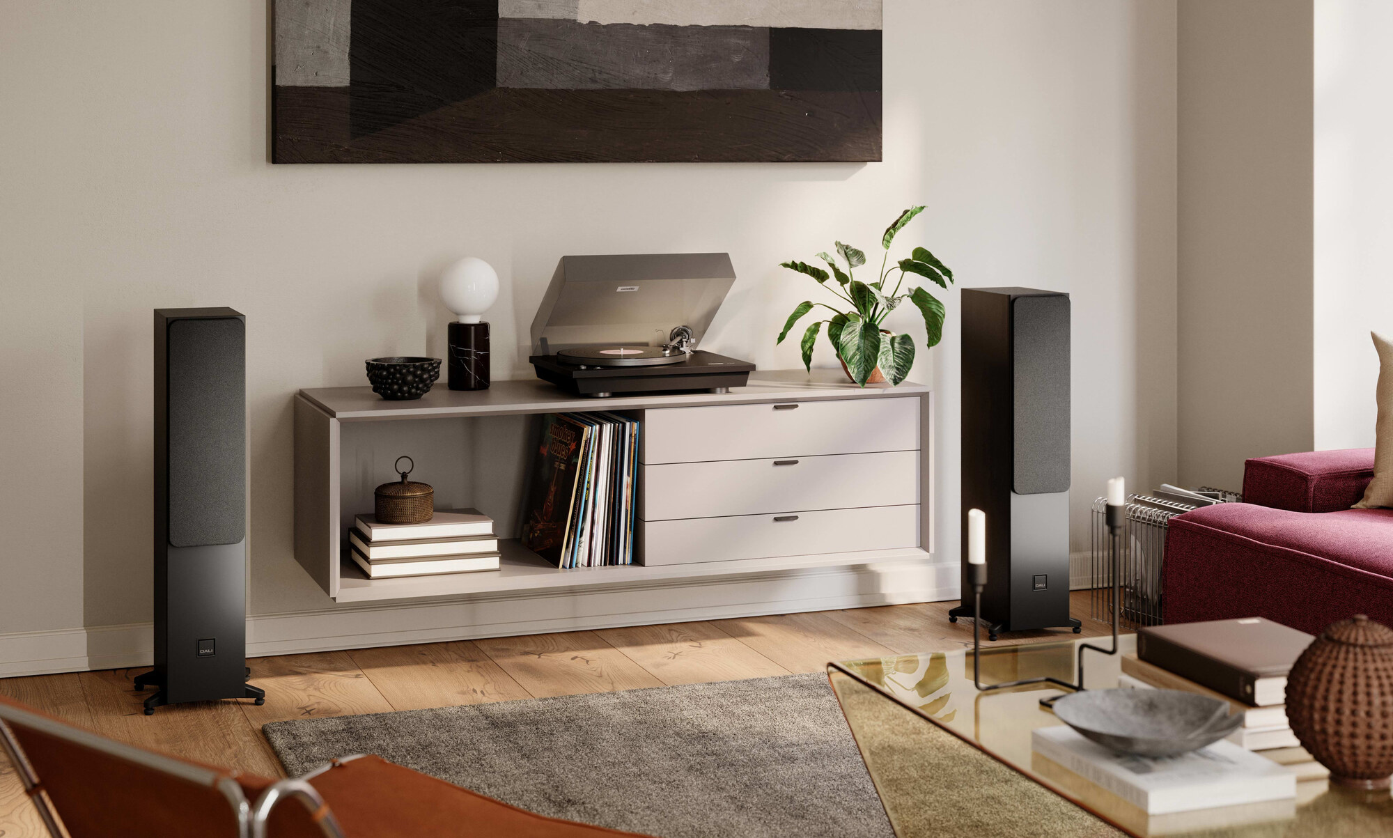 DALI Sonik 5 in black ash in a living room, 824 mm tall on its outrigger feet